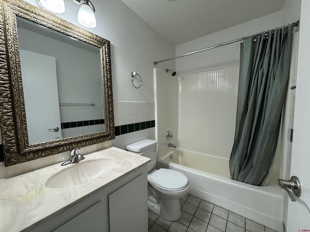 full bathroom with tile patterned floors, vanity, tile walls, toilet, and shower / tub combo with curtain