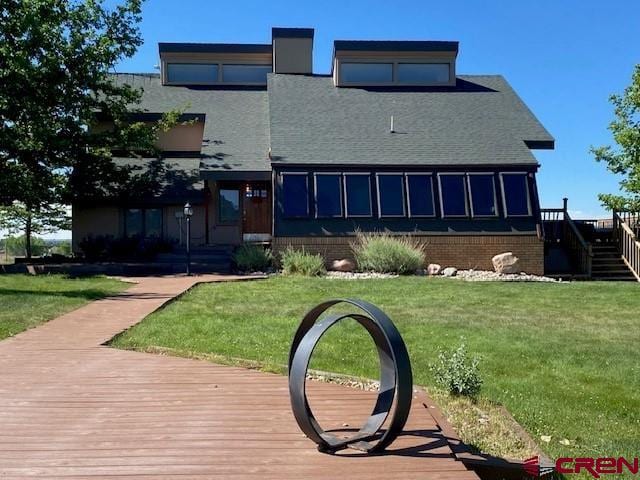 27813 Rd H.6, Cortez, CO 81321 - back of property featuring a lawn and stairs