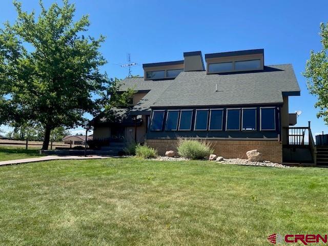27813 Rd H.6, Cortez, CO 81321 - rear view of property featuring a lawn and a shingled roof