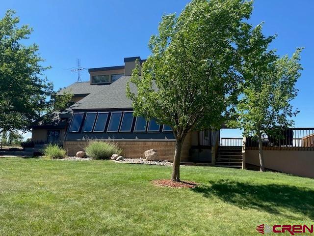 27813 Rd H.6, Cortez, CO 81321 - view of grassy yard with a wooden deck