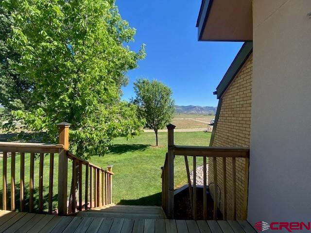 27813 Rd H.6, Cortez, CO 81321 - deck with a lawn and a mountain view