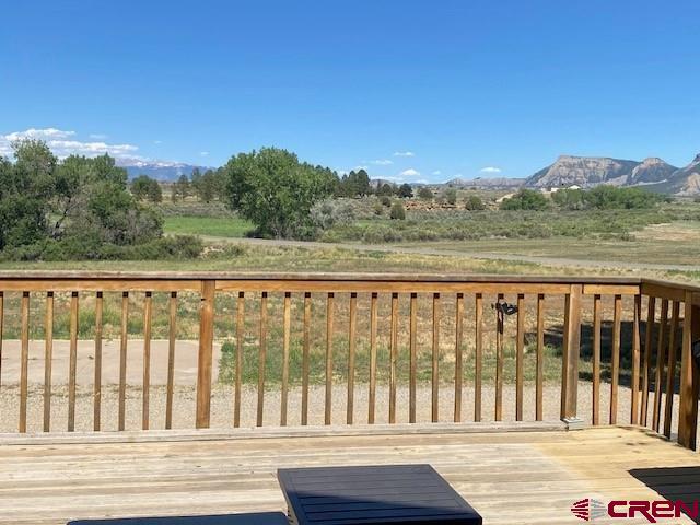 27813 Rd H.6, Cortez, CO 81321 - wooden terrace with a mountain view