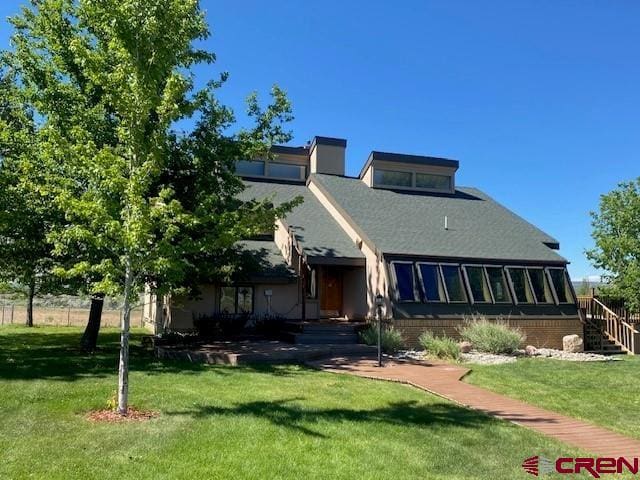 27813 Rd H.6, Cortez, CO 81321 - back of house featuring a yard and stairway