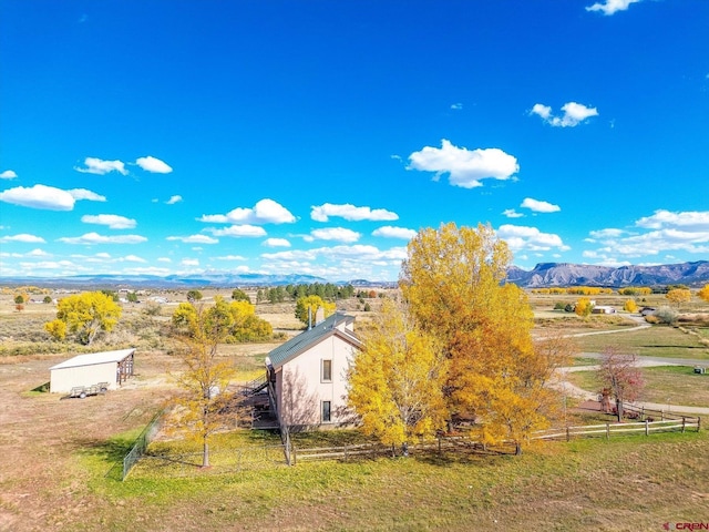 birds eye view of property with a rural view and a mountain view