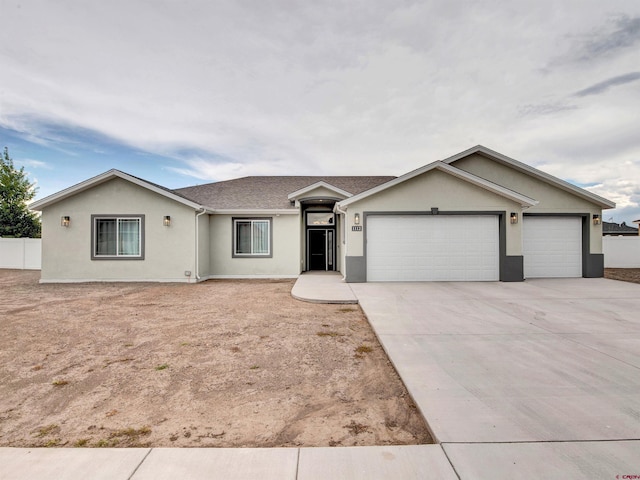 ranch-style house featuring a garage