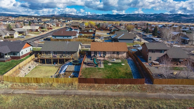 birds eye view of property with a mountain view