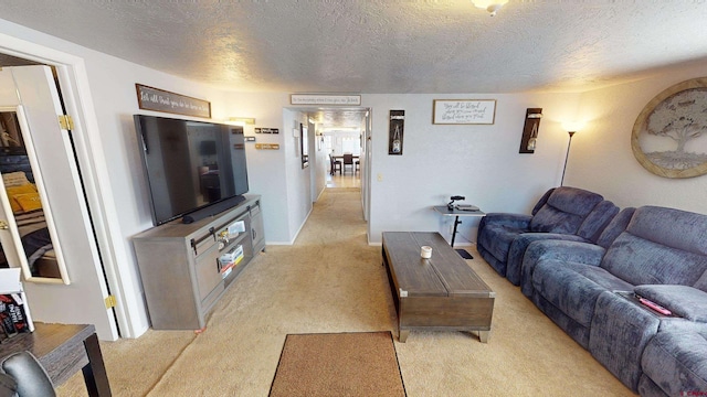 living room with light colored carpet and a textured ceiling