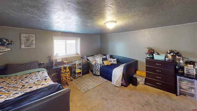 bedroom featuring a textured ceiling and light colored carpet