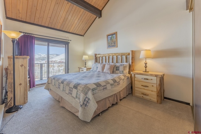 bedroom featuring light colored carpet, access to exterior, beamed ceiling, a mountain view, and wood ceiling