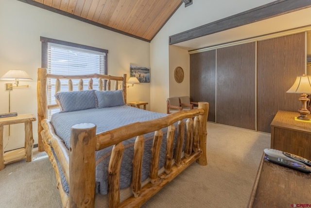 carpeted bedroom featuring a closet, wood ceiling, and vaulted ceiling with beams