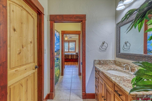 bathroom with tile patterned floors and vanity