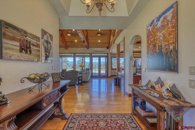 corridor with wood ceiling, hardwood / wood-style floors, and beamed ceiling