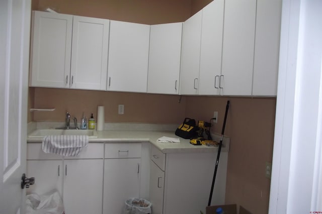 kitchen with white cabinets and sink