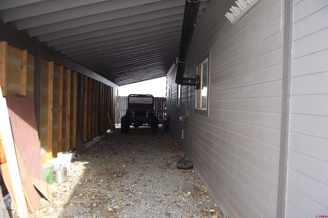 view of side of home featuring a carport