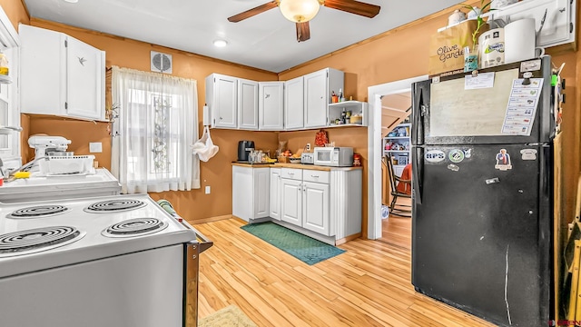 kitchen with light wood-type flooring, ceiling fan, white cabinetry, and white appliances