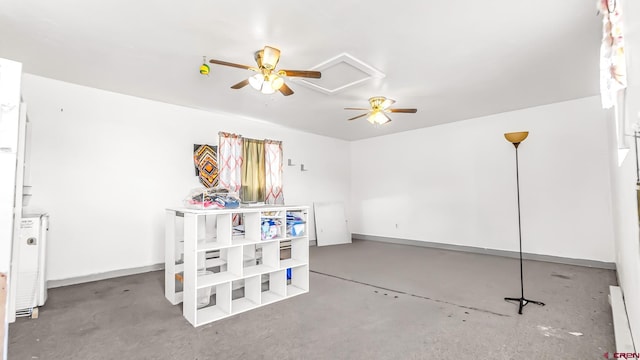 playroom featuring ceiling fan and concrete floors