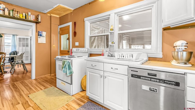 kitchen featuring light hardwood / wood-style floors, dishwasher, white electric stove, white cabinets, and sink