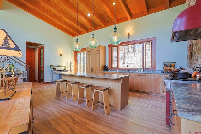 kitchen with extractor fan, hanging light fixtures, wood ceiling, stainless steel range oven, and high vaulted ceiling