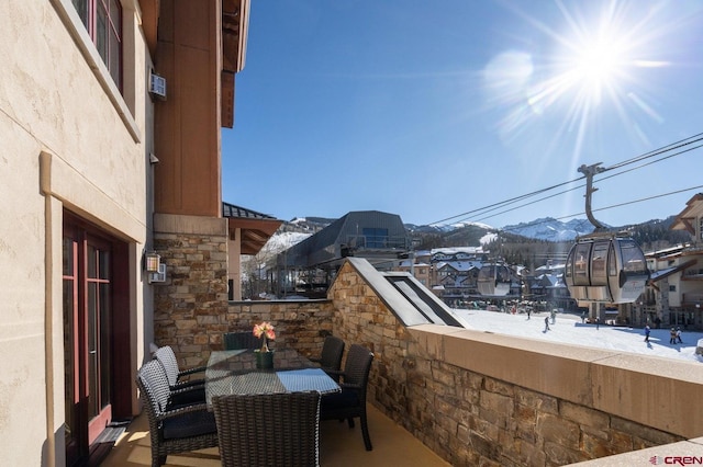 568 Mountain Village Blvd Unit 338, Telluride, CO 81435 - snow covered back of property with a mountain view