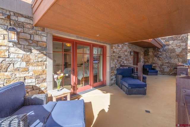 view of patio with outdoor lounge area and french doors