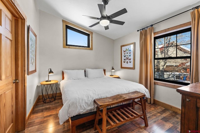 bedroom featuring ceiling fan, dark wood-type flooring, and lofted ceiling