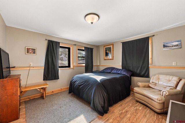 bedroom with hardwood / wood-style flooring