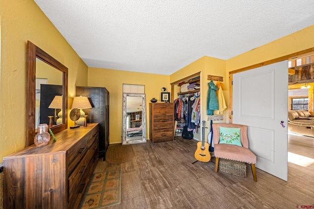 sitting room featuring hardwood / wood-style floors and a textured ceiling