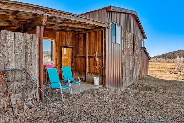 view of outbuilding with a mountain view