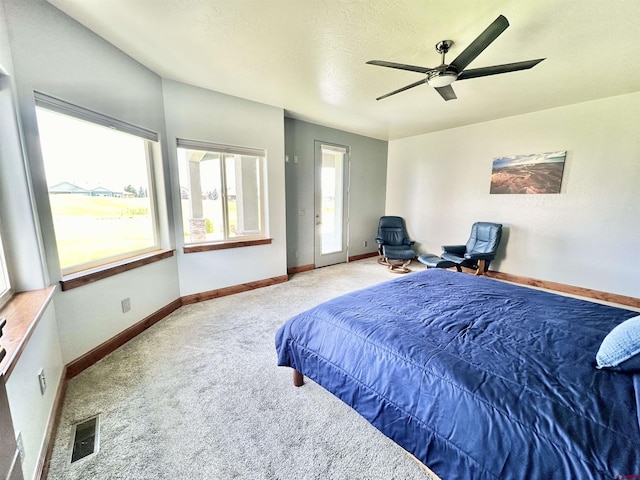 bedroom featuring ceiling fan and light colored carpet