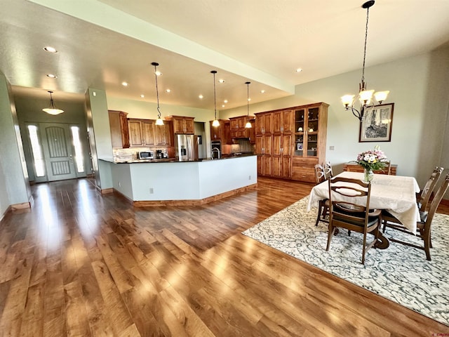 dining room featuring a chandelier and dark hardwood / wood-style flooring