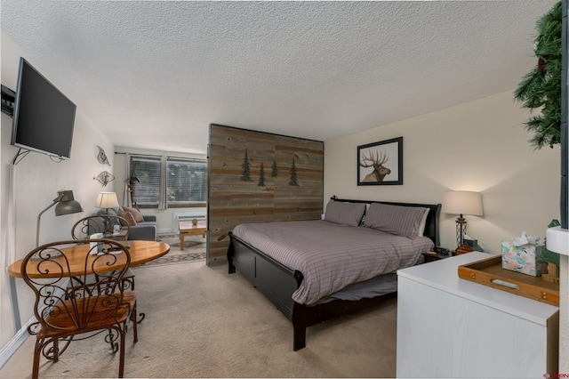 carpeted bedroom featuring a textured ceiling