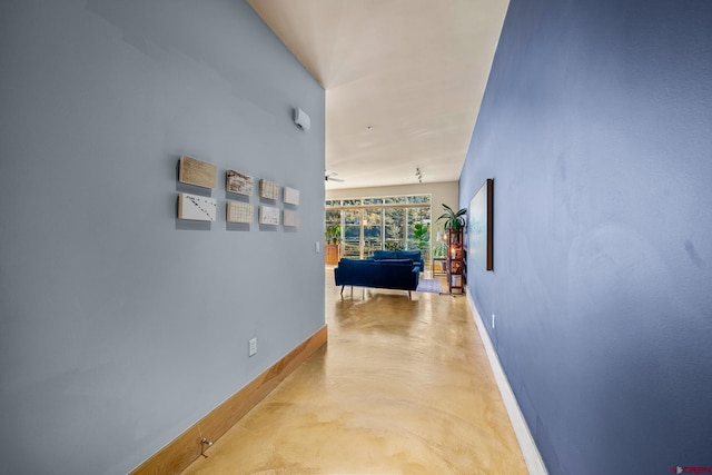 hall featuring concrete floors