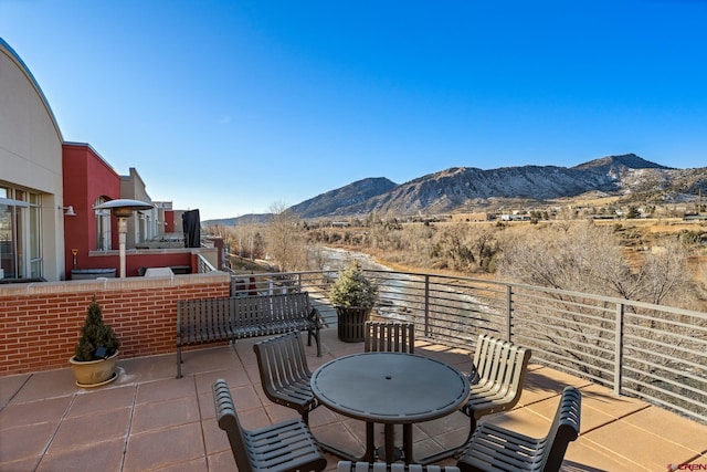 view of patio / terrace featuring a balcony and a mountain view