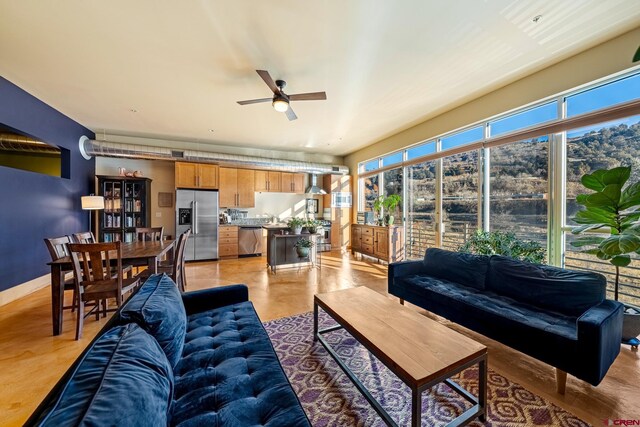 living room with ceiling fan