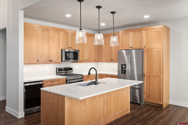 kitchen featuring appliances with stainless steel finishes, dark hardwood / wood-style flooring, light stone counters, a center island with sink, and beverage cooler