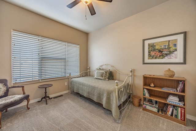 bedroom featuring ceiling fan and light colored carpet