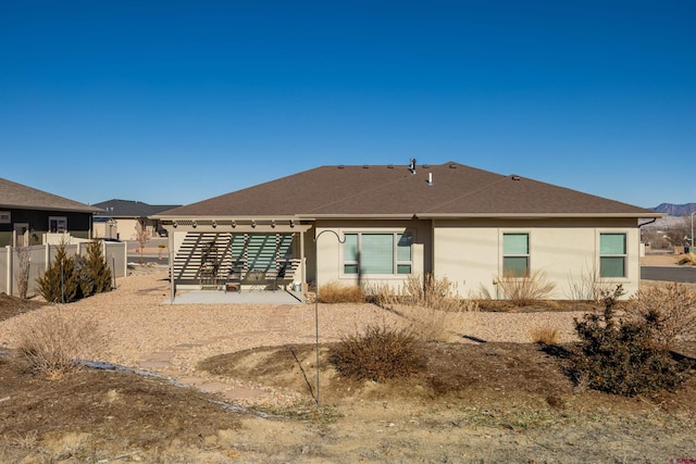 back of property featuring a patio