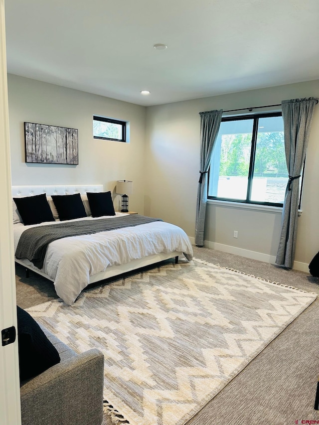 bedroom with light carpet