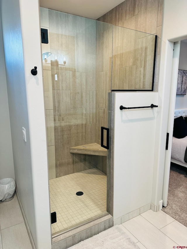 bathroom featuring walk in shower and tile patterned floors