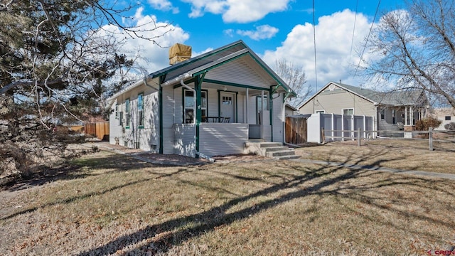 view of front of home with a front lawn and a porch