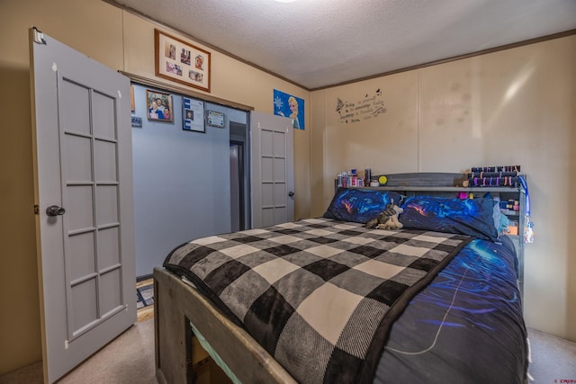 bedroom featuring carpet and a textured ceiling