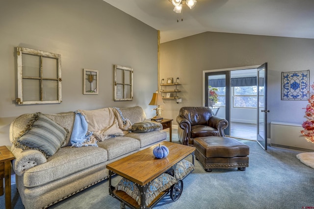 carpeted living room featuring lofted ceiling and ceiling fan