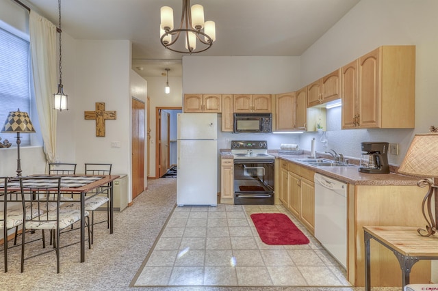 kitchen with white appliances, sink, hanging light fixtures, and light brown cabinets