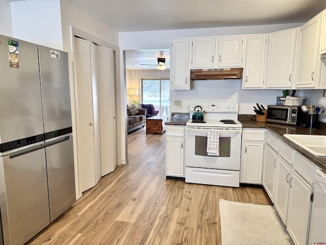 kitchen with white cabinetry, light hardwood / wood-style floors, and appliances with stainless steel finishes