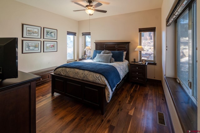 bedroom featuring dark hardwood / wood-style floors and ceiling fan