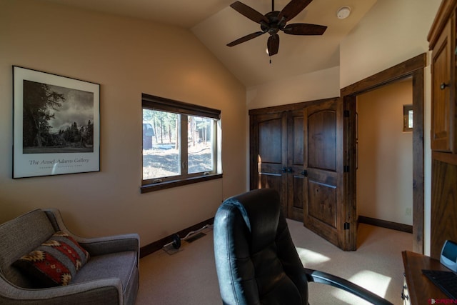 carpeted office space with ceiling fan and lofted ceiling