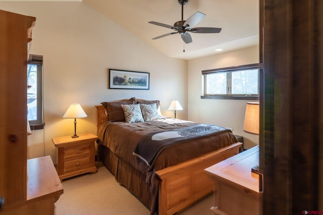 carpeted bedroom featuring lofted ceiling and ceiling fan