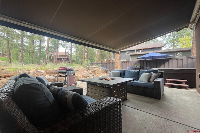 view of patio featuring an outdoor living space with a fire pit