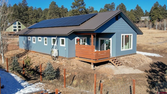 exterior space featuring solar panels