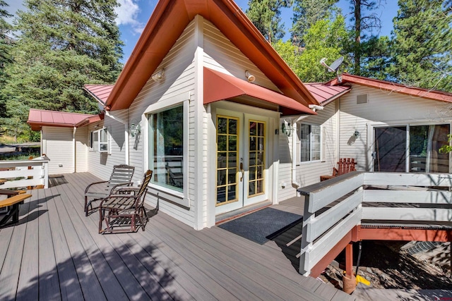 wooden terrace featuring french doors